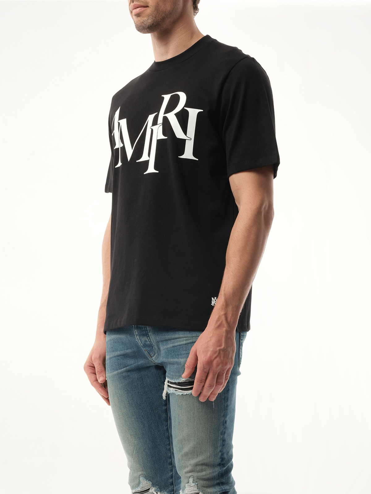 Amiri Staggered Logo T-Shirt in Black