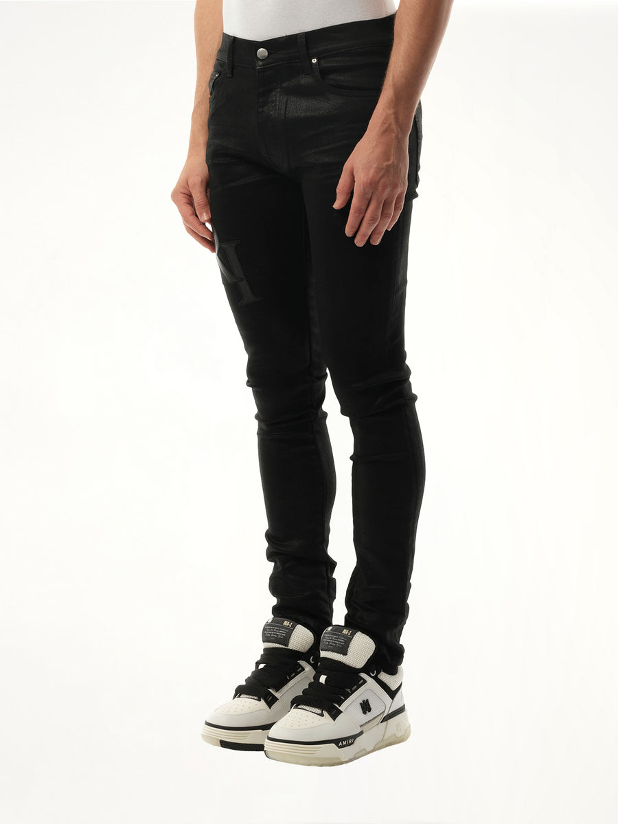 Waxed Staggered Logo Skinny Jeans in Black Wax